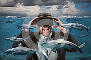 Businessman Using Virtual Reality Glasses Seeing Sharks