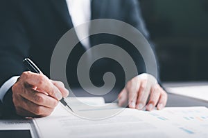 Businessman validates and manages business documents and agreements. , signing a business contract approval of contract documents