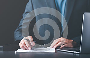 Businessman validates and manages business documents and agreements, signing a business contract approval of contract documents