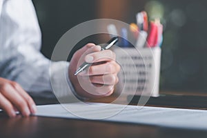 Businessman validates and manages business documents and agreements, signing a business contract approval of contract documents