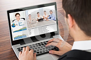 Businessman Video Conferencing On Laptop