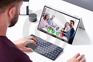 Businessman Video Conferencing On Laptop In The Office