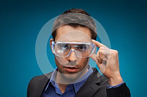 Businessman in virtual reality or 3d glasses