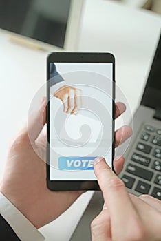 Businessman Voting Online by Smartphone