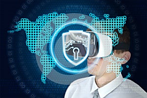 Businessman with VR glasses and interface with digital world map, shield and lock interface