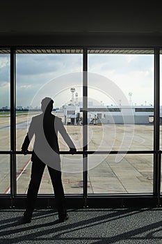 Businessman waiting for his flight in airport lounge