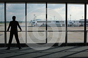 Businessman waiting for his flight in airport lounge