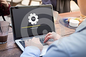 Businessman waiting for installing update with circle load percentage waiting indicator concept using laptop / computer