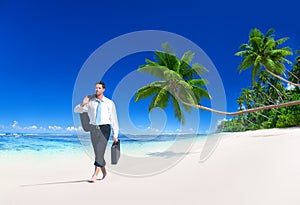 Businessman Walking Along Tropical Beach Concept