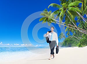 Businessman Walking Along the Tropical Beach Concept