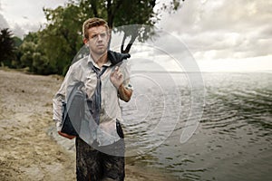 Businessman walking on the beach, desert island