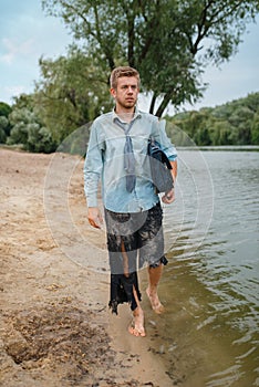 Businessman walking on the beach, lost island