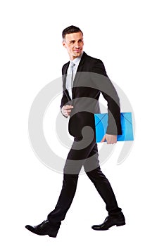 Businessman walking with blue folder