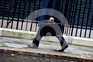 Businessman walking with briefcase