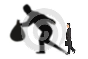 Businessman walking and holding bag with thief shadow