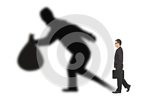 Businessman walking and holding bag with thief shadow photo