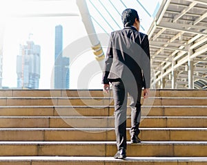 Businessman walking outdoor in the street footsteps