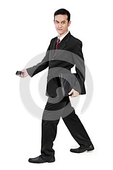 Businessman walking sideways