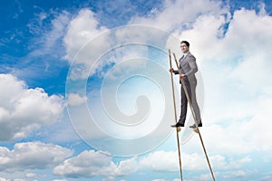 The businessman walking on stilts - standing out from the crowd