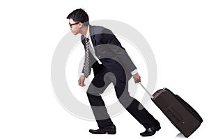 Businessman walking with suitcase