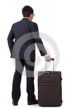 Businessman walking with suitcase