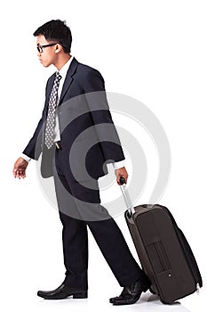 Businessman walking with suitcase
