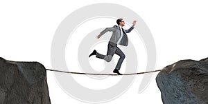 The businessman walking on tight rop in business concept