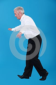 Businessman walking on tight-rope