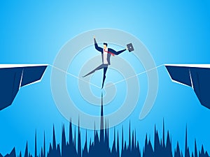 Businessman walking tightrope across the gap between hill. Walking over cliffs.Business risk and success concept.