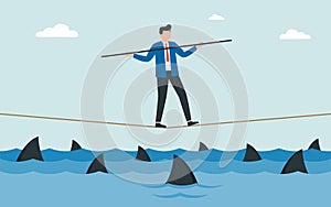 Businessman walking a tightrope with balancer stick over shark in water. Obstacle on road, financial crisis. Risk management