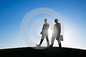 Businessman walking together conversation talking