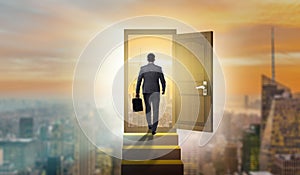 The businessman walking towards open door