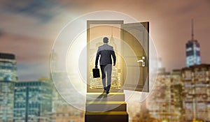 The businessman walking towards open door