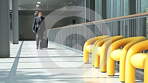 Businessman walking with trolley