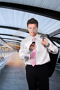 Businessman walks on a modern corridor photo