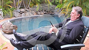 Businessman Walks By Pool