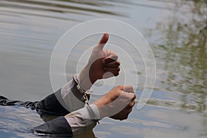 Businessman was arrested by handcuffs and drowning