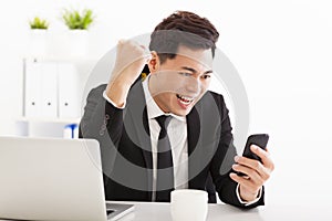 Businessman watching the smart phone in office