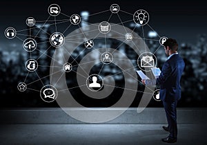 Businessman watching social network interface on a rooftop 3D re