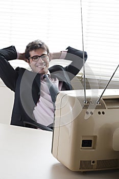 Businessman watching TV