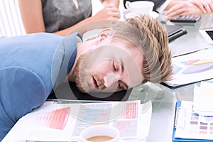 Businessman wear blue suit sleeping at white office desk breakdown looking tired. Business people working