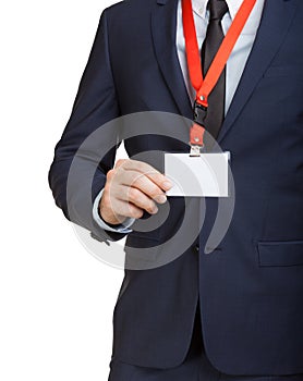 Businessman wearing a blank ID tag or name card on a lanyard at an exhibition or conference