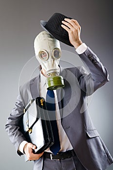 Businessman wearing gas mask