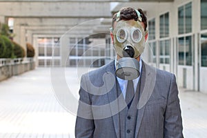 Businessman wearing gas mask in office space