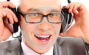 Businessman wearing headphones looking to camera