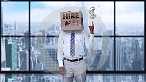 Businessman wearing hire me box and pointing on dollar sign