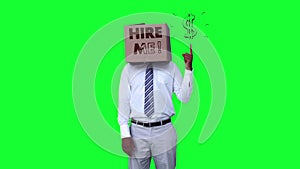 Businessman wearing hire me box and pointing on dollar sign against greenscreen