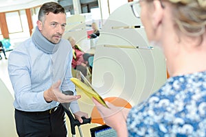 Businessman wearing neck brace with crutches