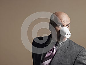 Businessman Wearing Plastic Cup as Pig Snout