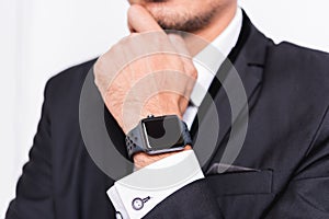 Businessman wearing suit with a smart modern watch
